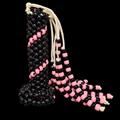 Black kandi whip with pink spiral beadwork and black-and-pink beaded tails