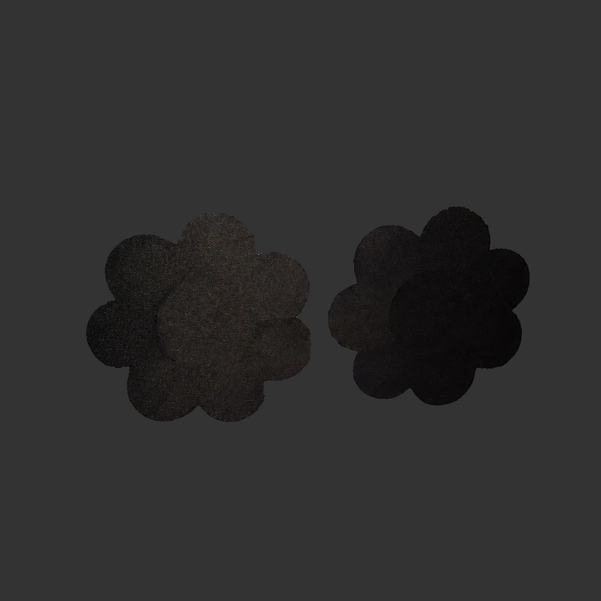 Black flower pasties on holographic packaging